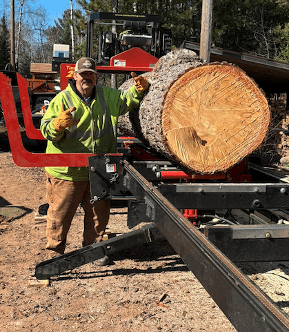 Paul Thiebault with a huge log on his TimberKing 2020